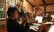 ILLUMINATING MUSIC: Walter Martella plays at last year&rsquo;s Carols by Candlelight. This year&rsquo;s event at Dwight Hall happens December 12 and 13. (Photo by Robert Colasanto.)
